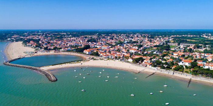 an aerial photo of la bernerie en retz village and beach in loire atlantique