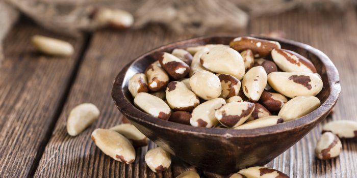 portion of healthy brazil nuts as detailed close-up shot)