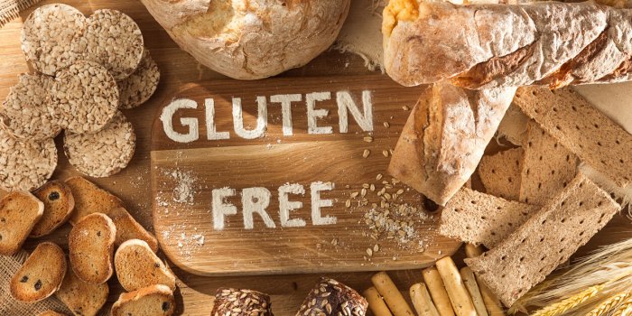 gluten free food various pasta, bread and snacks on wooden background from top view healthy and diet concept