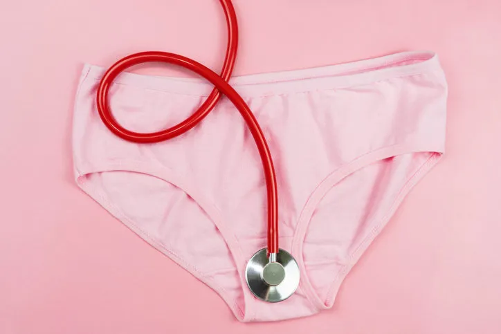 pink underpants and red stethoscope isolated on pink backgroundwoman hygiene, concept of sanitary pad,critical days, menstruation,health care pink underpants and red stethoscope isolated on pink backgroundwoman hygiene, concept of sanitary pad,critical days, menstruation,health care
