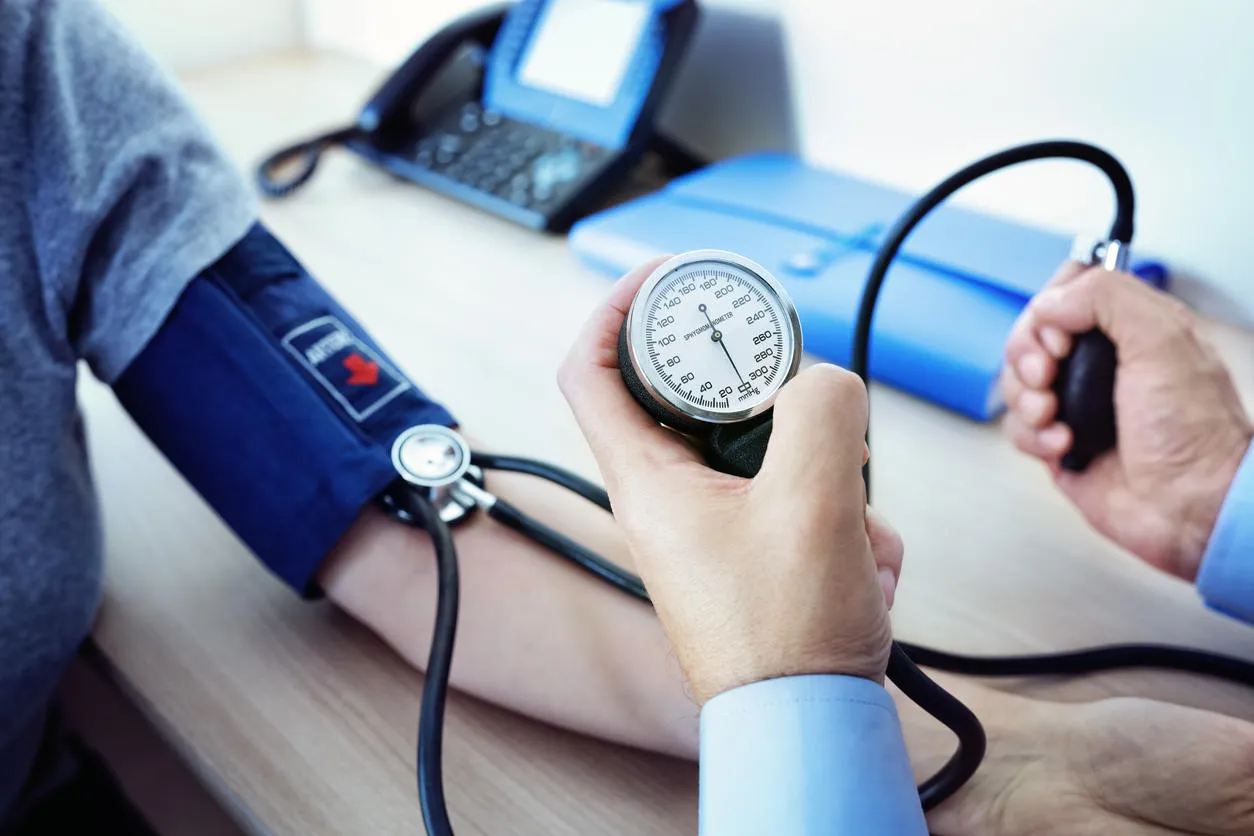 doctor checking the blood pressure of a patient doctor checking the blood pressure of a patient
