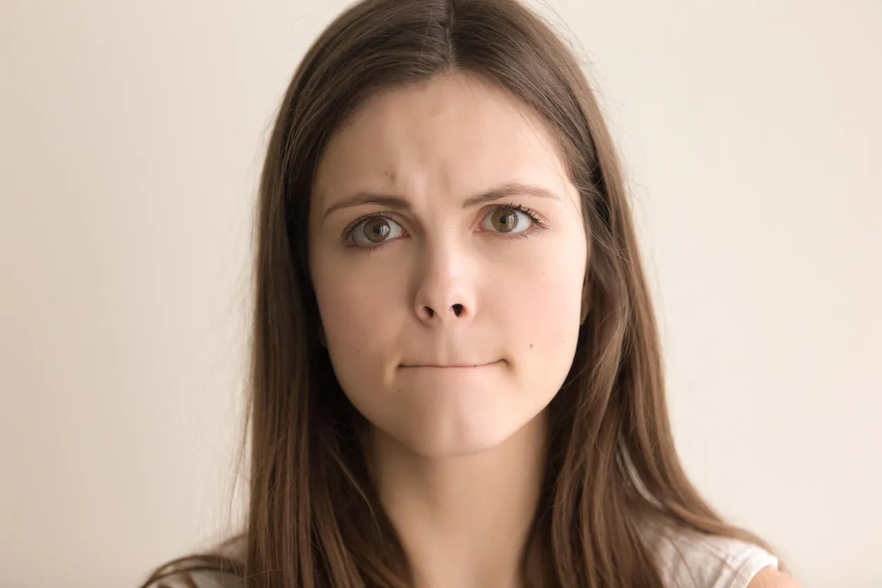 headshot portrait of indecisive young woman beautiful teen girl with pursed lips and worried facial expression looking at camera nervous tension, bad feelings and stress close up front view headshot portrait of indecisive young woman beautiful teen girl with pursed lips and worried facial expression looking at camera nervous tension, bad feelings and stress close up front view