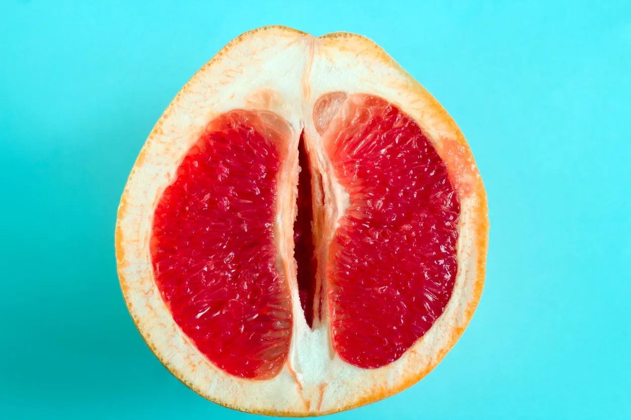 ripe juicy grapefruit isolated on a blue background