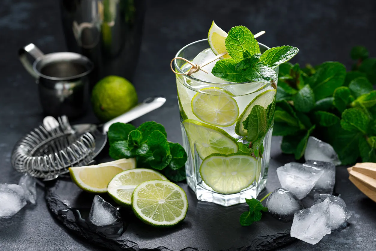 refreshing summer alcoholic cocktail mojito with ice, fresh mint and lime