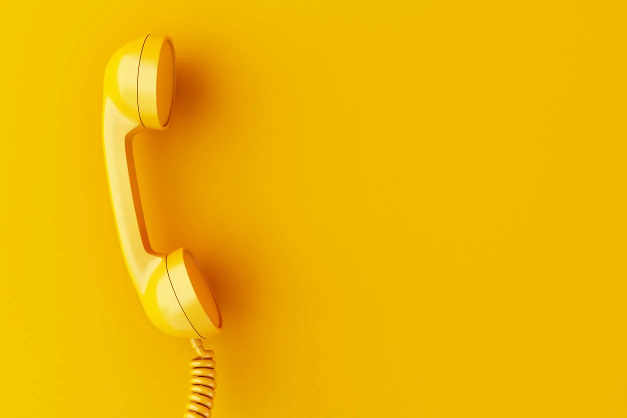 3d illustration vintage phone reciever on yellow background 3d illustration vintage phone reciever on yellow background