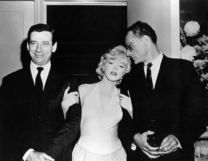file picture dated 1960 of us actress marilyn monroe with her husband, playwright arthur miller (r), and french actor yves montand attending a party for the launch of the movie 'let's make love' photo by lfi abaca , 73227 08 inconnu unknown