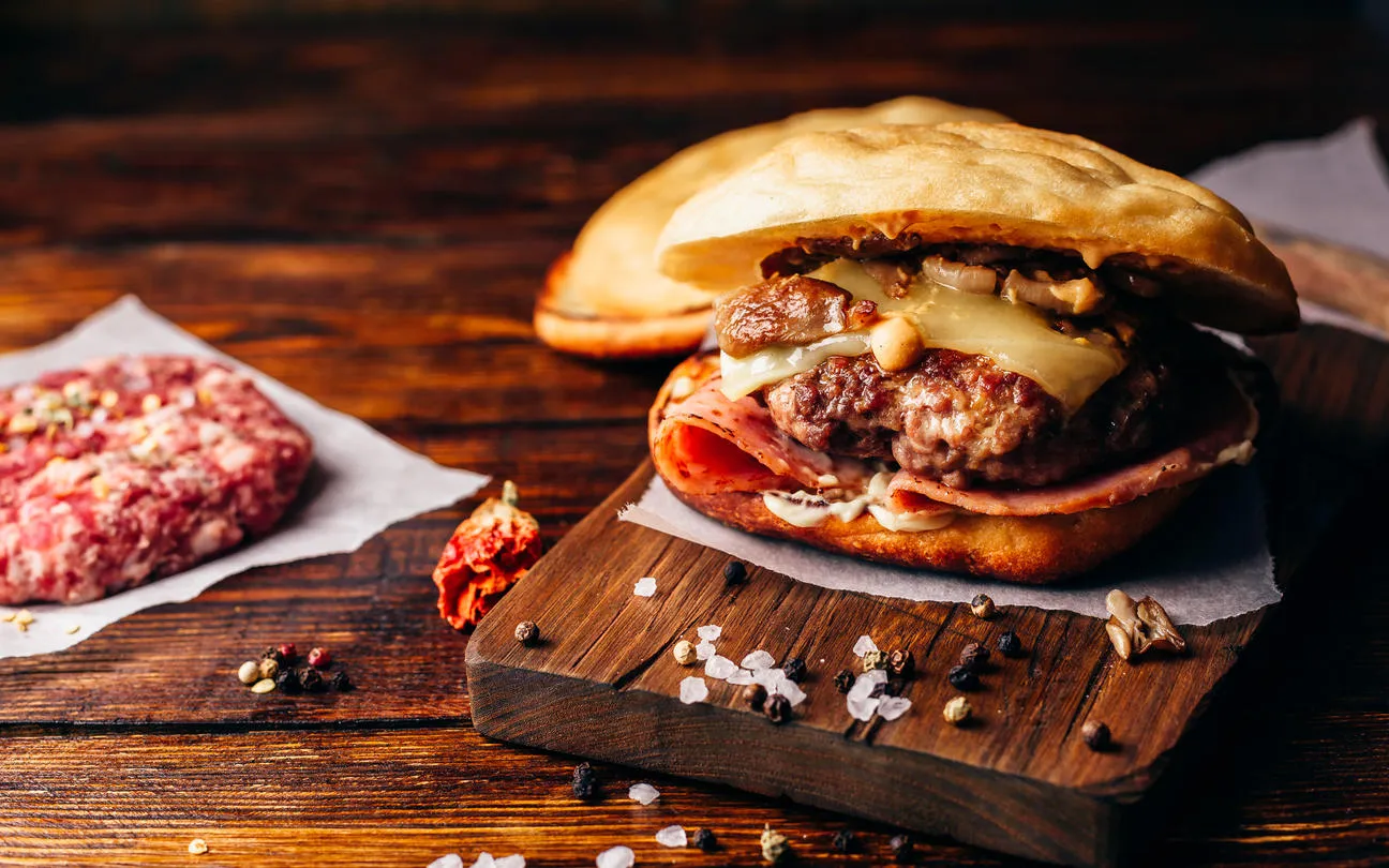 cheeseburger with beef patty, wisconsin swiss cheese, ham, sauteed mushrooms, dijon mustard, mayonnaise and potato roll cheeseburger with beef patty, wisconsin swiss cheese, ham, sauteed mushrooms, dijon mustard, mayonnaise and potato roll