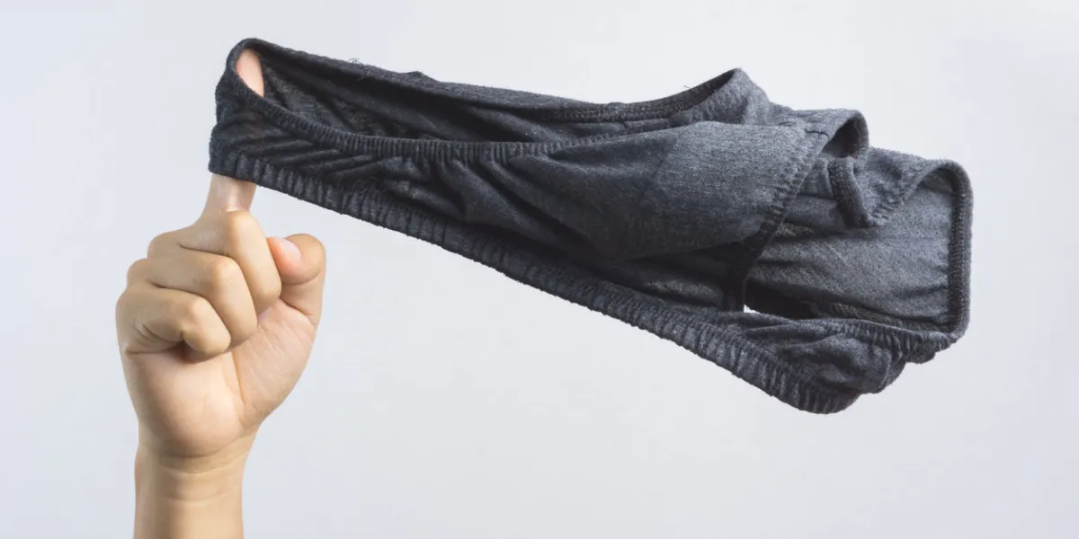hand holding man underwear or underpants for men on white background hand holding man underwear or underpants for men on white background