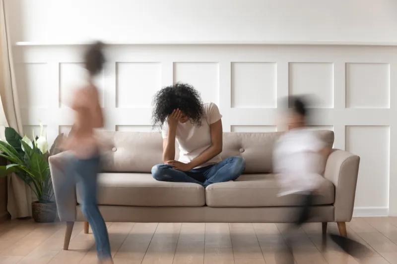 frustrated stressed single african mom having headache feel tired annoyed about noisy active kids playing at home, upset disturbed black mother fatigued of difficult disobedient misbehaving children frustrated stressed single african mom having headache feel tired annoyed about noisy active kids playing at home, upset disturbed black mother fatigued of difficult disobedient misbehaving children