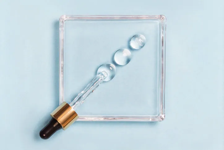 drops of hyaluron on a blue background medical concept oxygen filled fluid drops of hyaluron on a blue background medical concept oxygen filled fluid