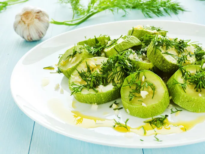steamed zucchini with garlic, fennel and oil shallow dof steamed zucchini with garlic, fennel and oil shallow dof
