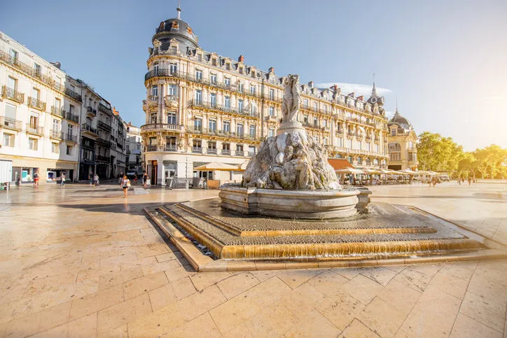 view on the comedy square with fountain of three graces during the morning light in montpellier city in southern france view on the comedy square with fountain of three graces during the morning light in montpellier city in southern france