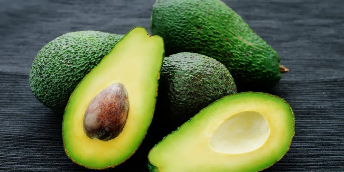 avocado on a black background tinting selective focus avocado on a black background tinting selective focus
