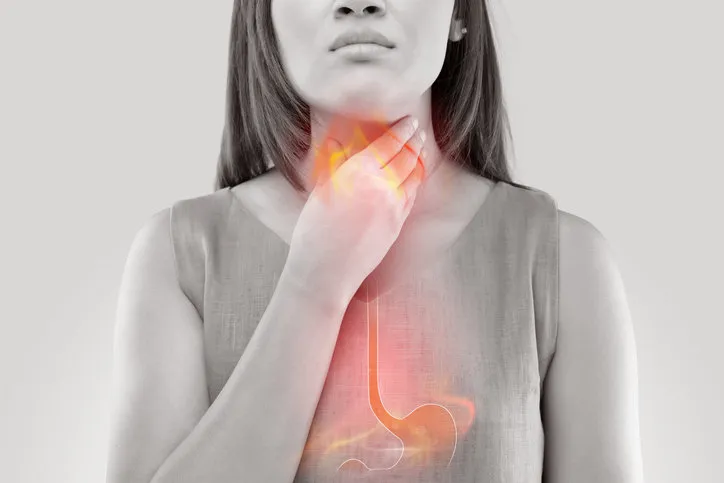 woman suffering from acid reflux or heartburn-isolated on white background woman suffering from acid reflux or heartburn-isolated on white background