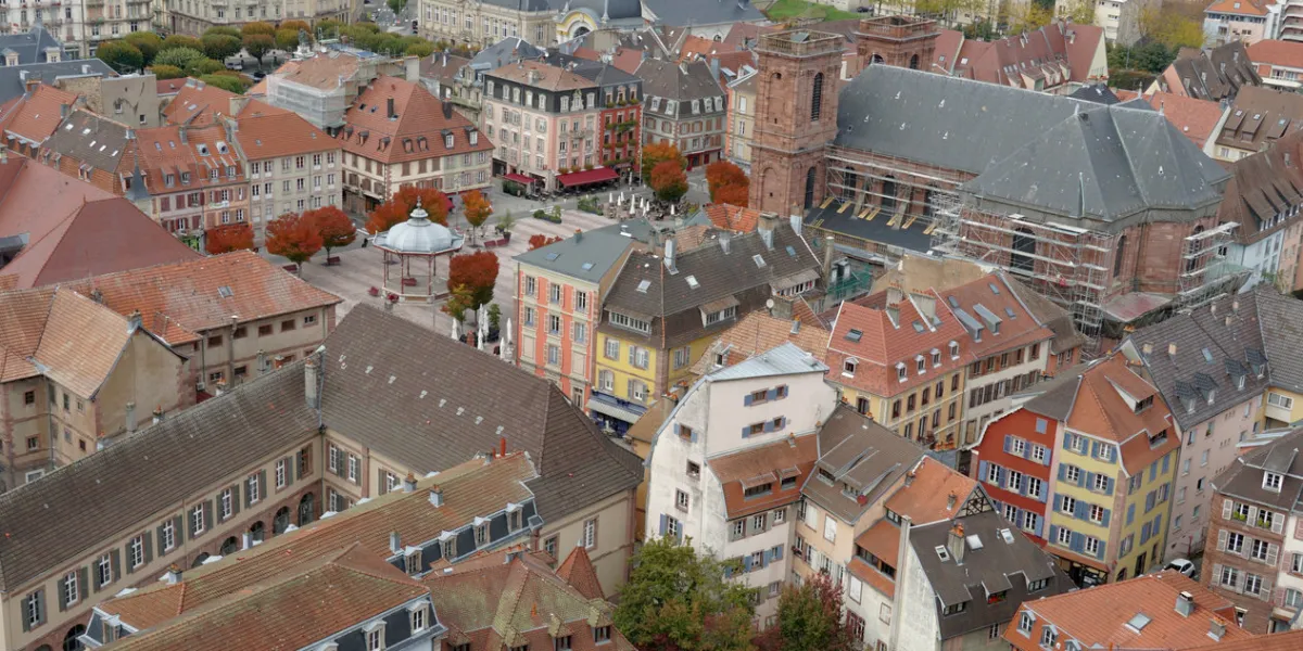 rooftops of the old city of belfort aerial view of the historic houses and buildings arranged densely to each other view from the citadel or fortress surrounding the city
