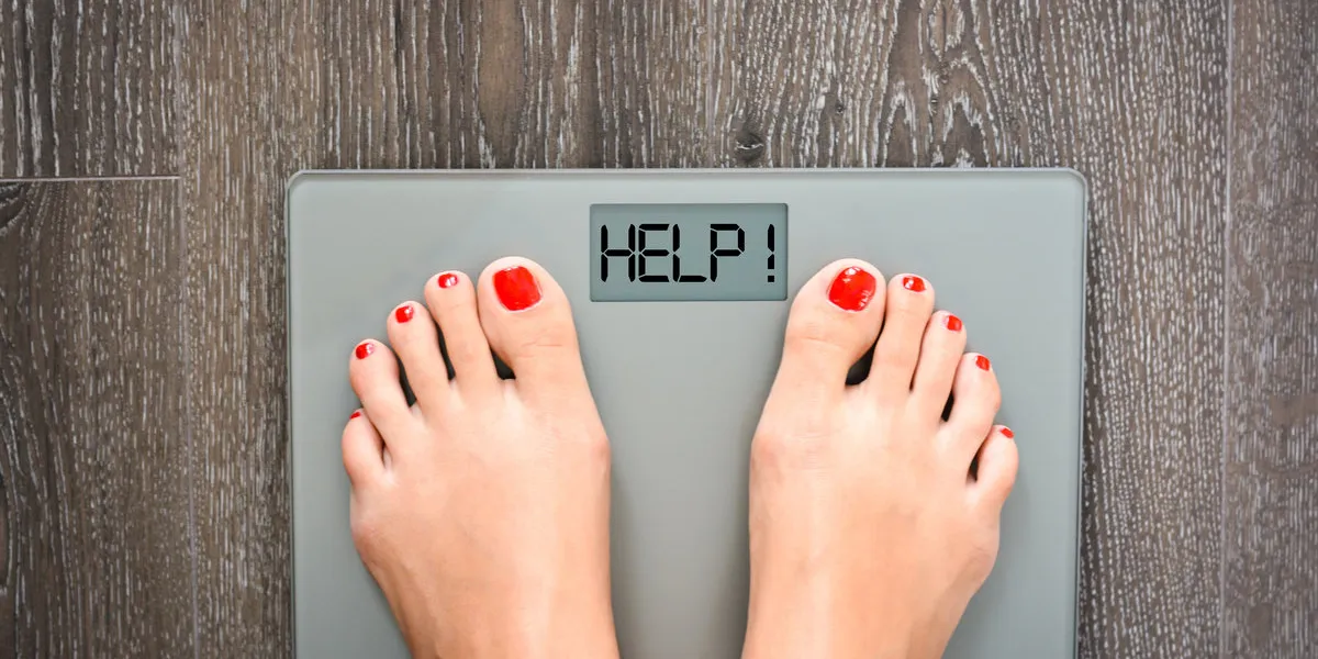 lose weight concept with person on a scale measuring kilograms lose weight concept with person on a scale measuring kilograms
