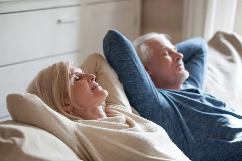 calm senior mature couple relaxing on soft comfortable sofa having daytime nap together, carefree middle aged old family breathing fresh air enjoying no stress free peaceful weekend resting on couch calm senior mature couple relaxing on soft comfortable sofa having daytime nap together, carefree middle aged old family breathing fresh air enjoying no stress free peaceful weekend resting on couch