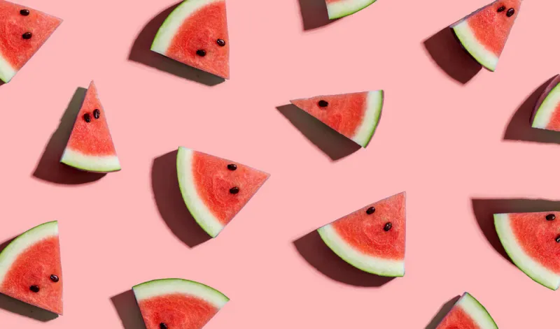 sliced watermelons arranged on a pink background sliced watermelons arranged on a pink background