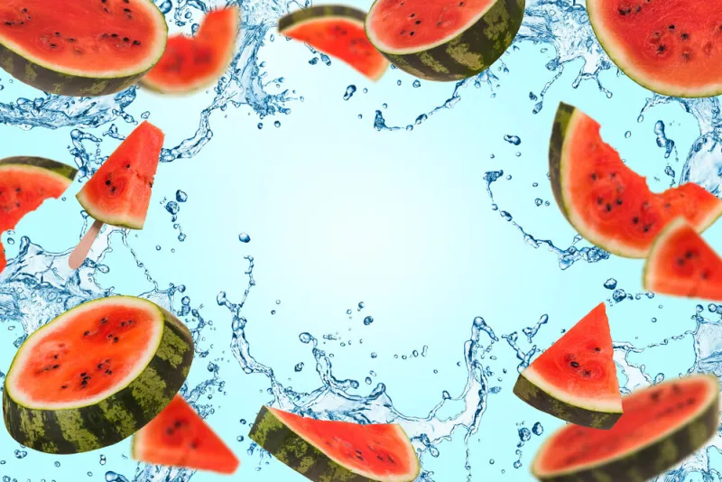 ripe watermelon cut into pieces flying in the air, with splash of water floating, flying, levitating sliced fresh watermelon on a background creative and abstract food concept copy space ripe watermelon cut into pieces flying in the air, with splash of water floating, flying, levitating sliced fresh watermelon on a background creative and abstract food concept copy space