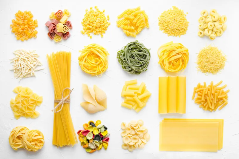 variety of types and shapes of italian pasta in rows on white background from above italian cuisine food concept and menu design dry pasta background texture top view flat lay variety of types and shapes of italian pasta in rows on white background from above italian cuisine food concept and menu design dry pasta background texture top view flat lay