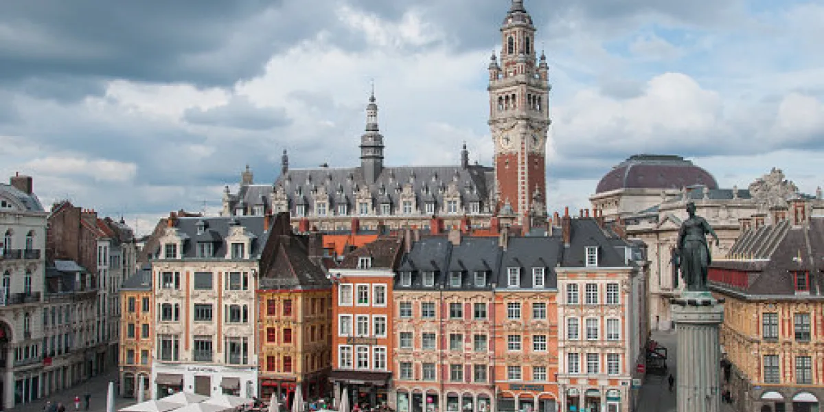 lille, france, may, 2012 place du general de gaulle (grand place) historic city center with clock tower, buildings, goddess statue lille, france 2012 editorial use only lille, france, may, 2012 place du general de gaulle (grand place) historic city center with clock tower, buildings, goddess statue lille, france 2012 editorial use only