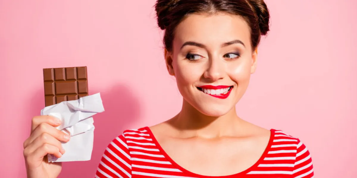close-up portrait of nice cute charming attractive winsome glamorous cheerful girl wearing striped t-shirt holding in hands looking favorite dessert life lifestyle advert isolated on pink background close-up portrait of nice cute charming attractive winsome glamorous cheerful girl wearing striped t-shirt holding in hands looking favorite dessert life lifestyle advert isolated on pink background