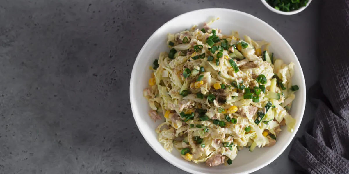 fresh vegetable salad with cabbage, canned cod liver, sweet corn, cucumber and quail eggs healthy balanced diet fresh vegetable salad with cabbage, canned cod liver, sweet corn, cucumber and quail eggs healthy balanced diet