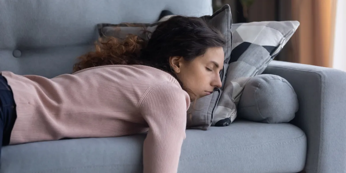 exhausted young caucasian woman lying on comfortable sofa in living room sleeping after hard-working day, tired millennial female fall asleep on couch at home, take nap or daydream, fatigue concept exhausted young caucasian woman lying on comfortable sofa in living room sleeping after hard-working day, tired millennial female fall asleep on couch at home, take nap or daydream, fatigue concept