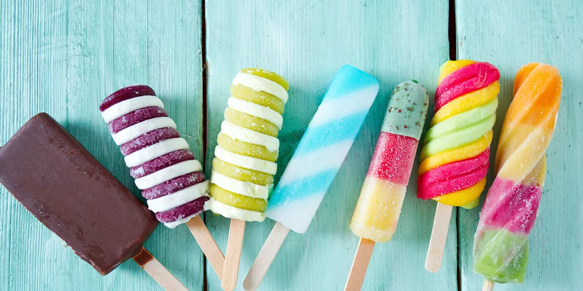 colorful popsicle ice cream on turquoise wooden background colorful popsicle ice cream on turquoise wooden background