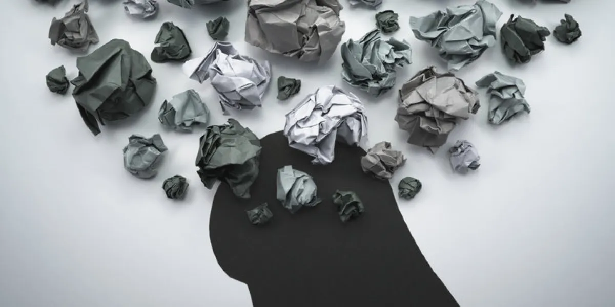 concept image of anxiety and negative emotion waste paper and head silhouette concept image of anxiety and negative emotion waste paper and head silhouette