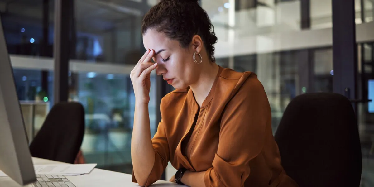 woman working at night with headache, burnout and stress over social media marketing project or company deadline anxiety, exhausted and tired online advertising or web promotion expert with migraine woman working at night with headache, burnout and stress over social media marketing project or company deadline anxiety, exhausted and tired online advertising or web promotion expert with migraine