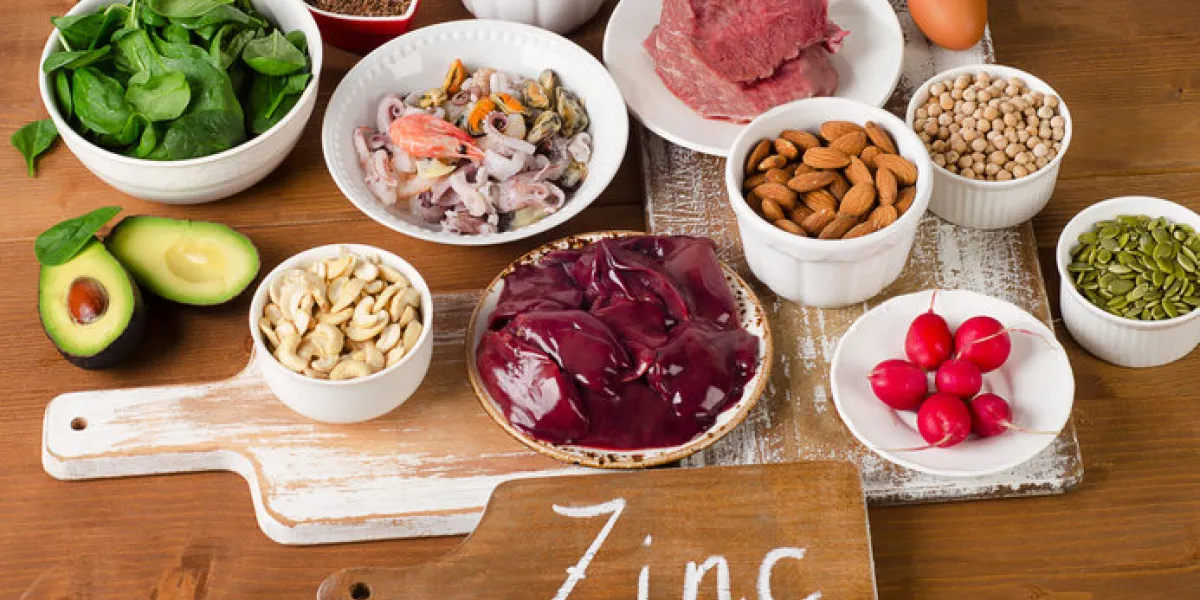 foods with zinc mineral on a wooden table top view foods with zinc mineral on a wooden table top view