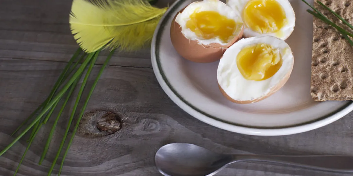 fresh boiled eggs and green spring onion on plate on wooden table healthy breakfast fresh boiled eggs and green spring onion on plate on wooden table healthy breakfast