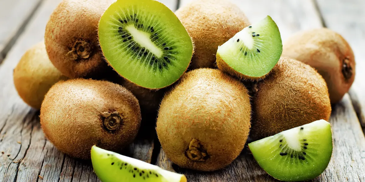 kiwi on white wood background tinting selective focus kiwi on white wood background tinting selective focus