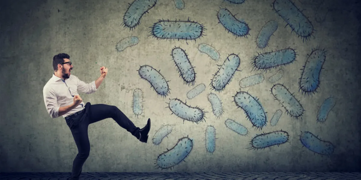 angry confident young man fighting bacteria angry confident young man fighting bacteria