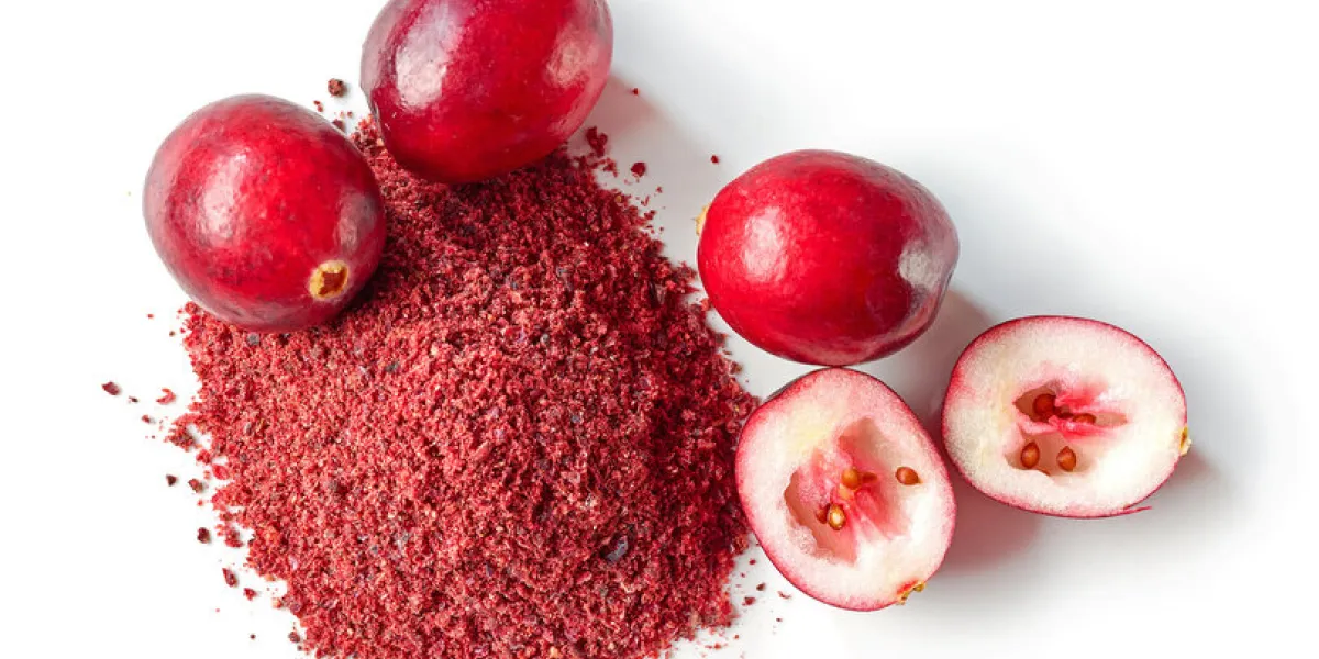 heap of dried cranberry powder and fresh cranberries isolated on white background, top view heap of dried cranberry powder and fresh cranberries isolated on white background, top view