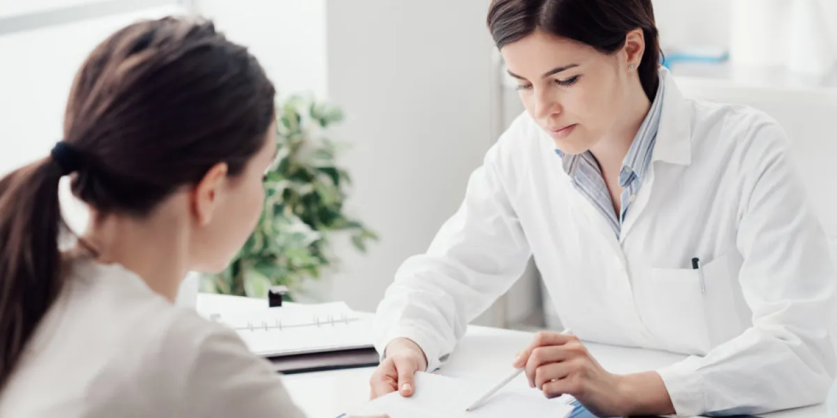 female doctor giving a consultation to a patient and explaining medical informations and diagnosis female doctor giving a consultation to a patient and explaining medical informations and diagnosis