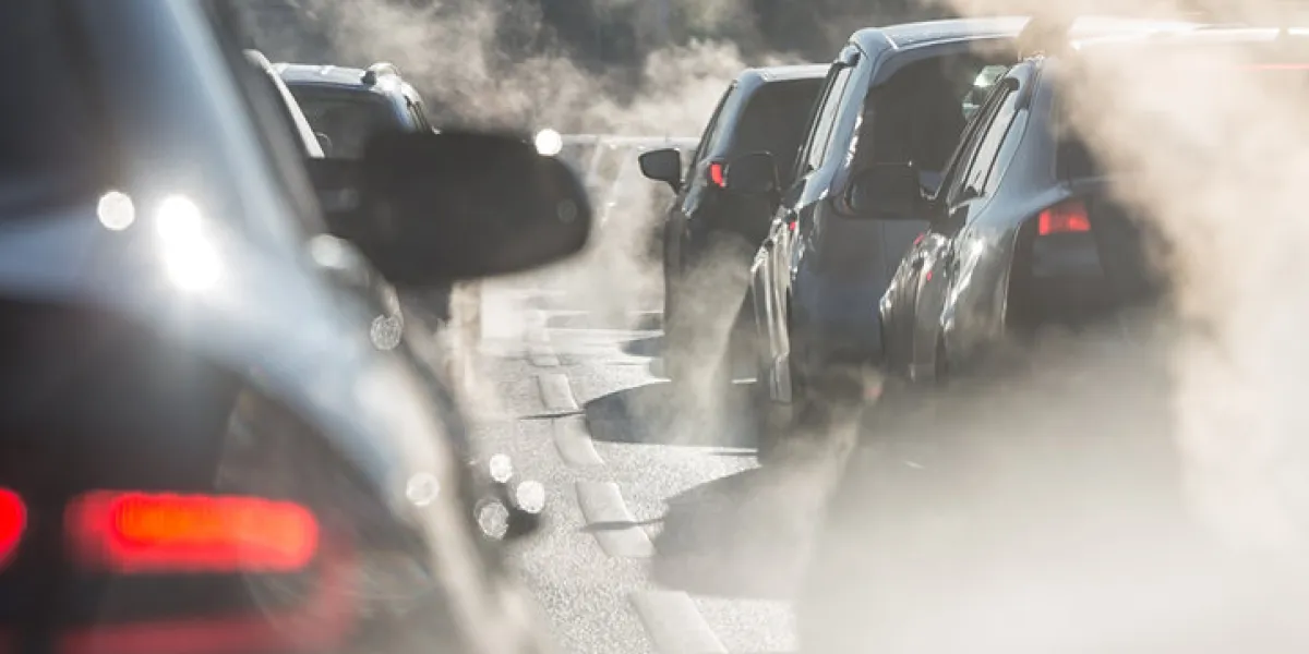 moscow, russia - august 08, 2017 traffic jam blurred silhouettes of cars surrounded by steam from the exhaust pipes environmental pollution moscow, russia - august 08, 2017 traffic jam blurred silhouettes of cars surrounded by steam from the exhaust pipes environmental pollution