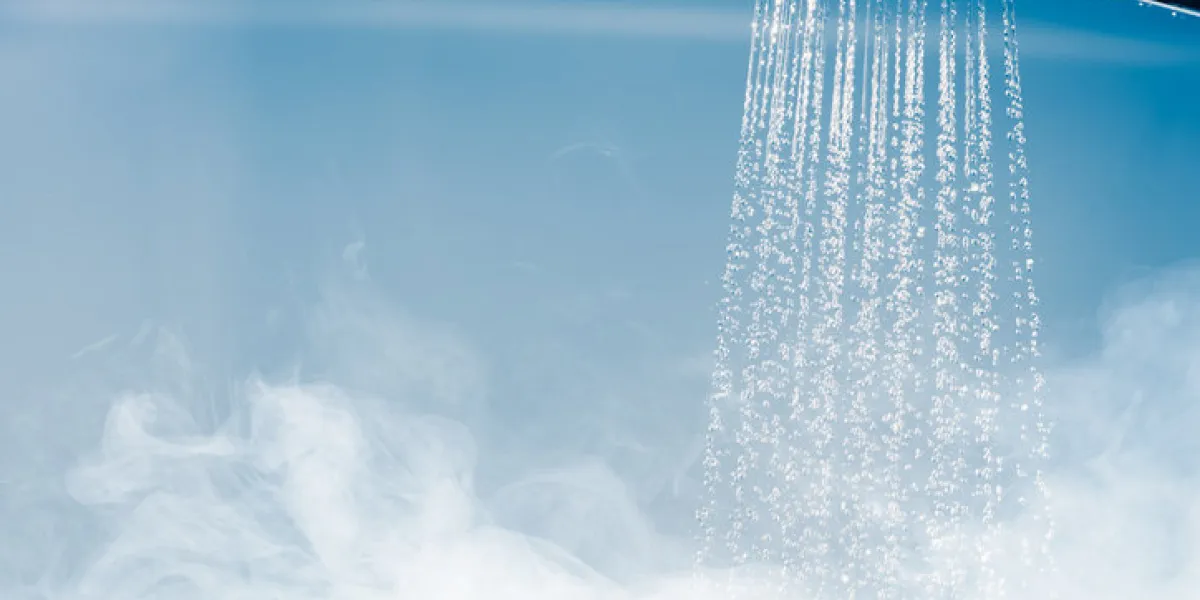 shower with flowing water and steam