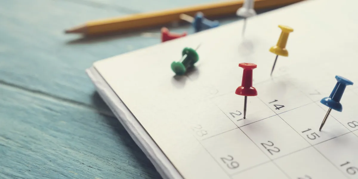 close up of calendar on the table, planning for business meeting or travel planning concept