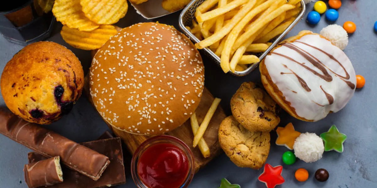 assortment of unhealthy products that's bad for figure, skin, heart and teeth fast carbohydrates food space for text assortment of unhealthy products that's bad for figure, skin, heart and teeth fast carbohydrates food space for text