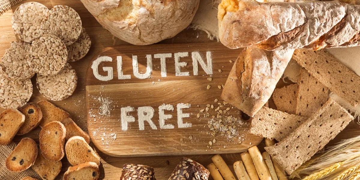 gluten free food various pasta, bread and snacks on wooden background from top view healthy and diet concept