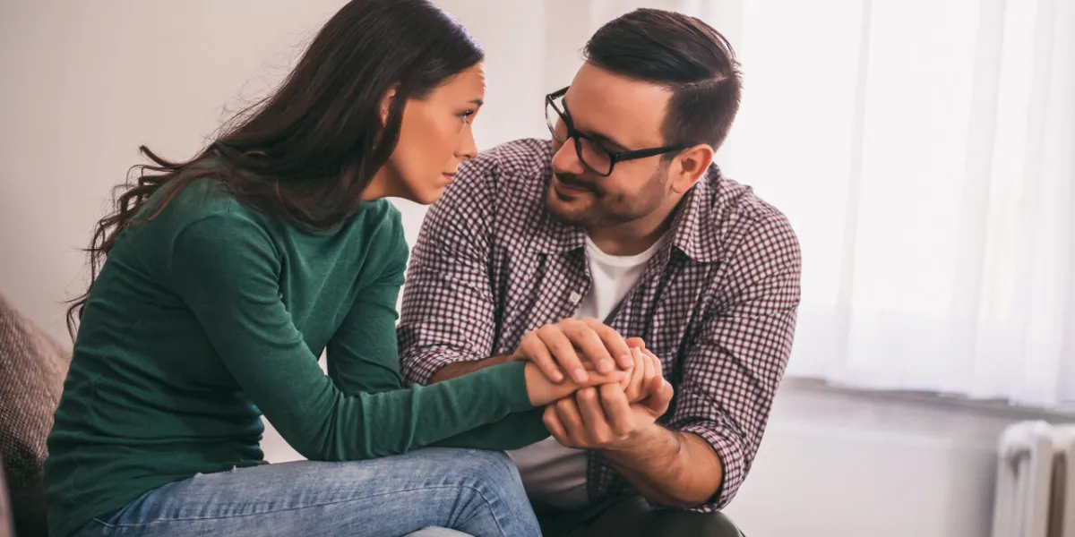 woman is sad and depressed, her man is consoling her woman is sad and depressed, her man is consoling her