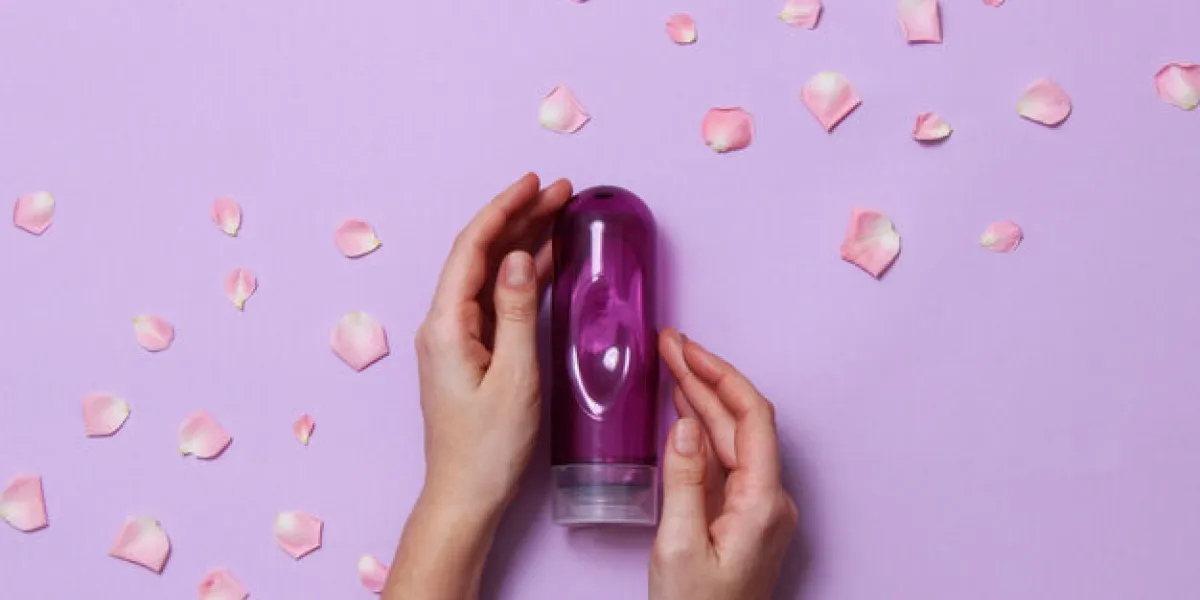 an intimate grease on a pastel background in female hands and ro an intimate grease on a pastel background in female hands and ro