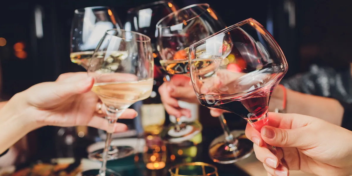 clinking glasses with alcohol and toasting, party