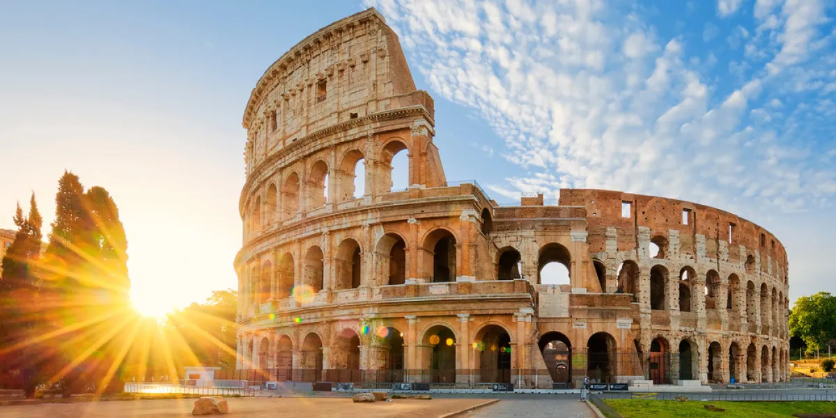 panoramic view of colosseum in rome and morning sun, italy, europe panoramic view of colosseum in rome and morning sun, italy, europe
