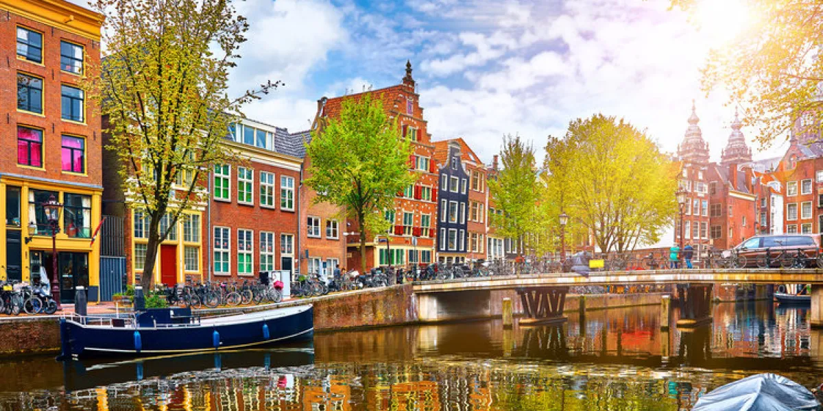 channel in amsterdam netherlands houses river amstel landmark old european city spring landscape channel in amsterdam netherlands houses river amstel landmark old european city spring landscape