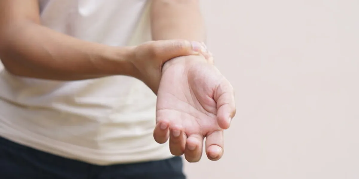woman has muscle weakness in her hand woman has muscle weakness in her hand