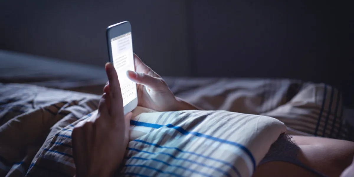 woman using phone late at night in bed person looking at text messages with cell in dark home hipster online dating or texting with smartphone sexting or cheating concept smart device screen light woman using phone late at night in bed person looking at text messages with cell in dark home hipster online dating or texting with smartphone sexting or cheating concept smart device screen light