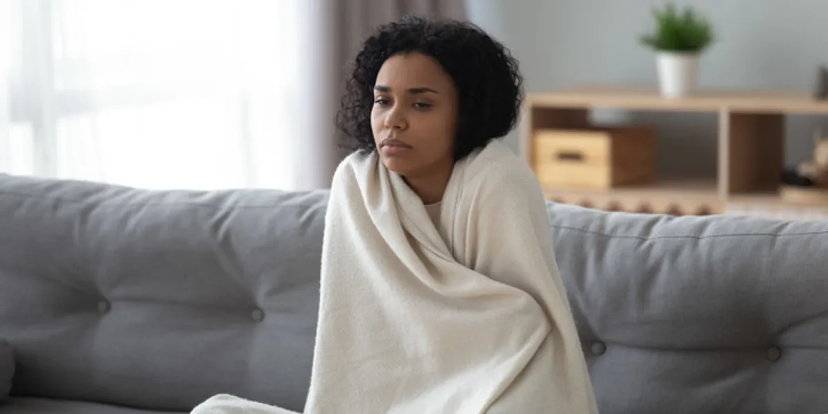 sick young african woman feeling cold covered with blanket sit on sofa, ill black girl shivering freezing warming at home wrapped with plaid, no central heating problem, fever temperature flu concept sick young african woman feeling cold covered with blanket sit on sofa, ill black girl shivering freezing warming at home wrapped with plaid, no central heating problem, fever temperature flu concept